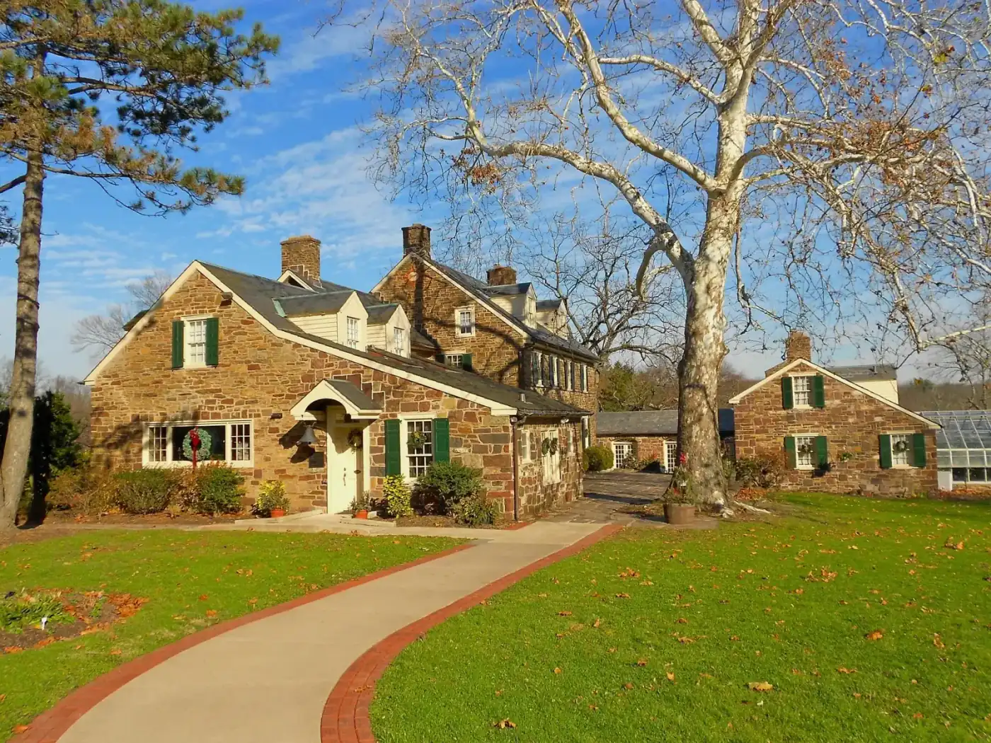 Classic stone home with manicured landscaping
